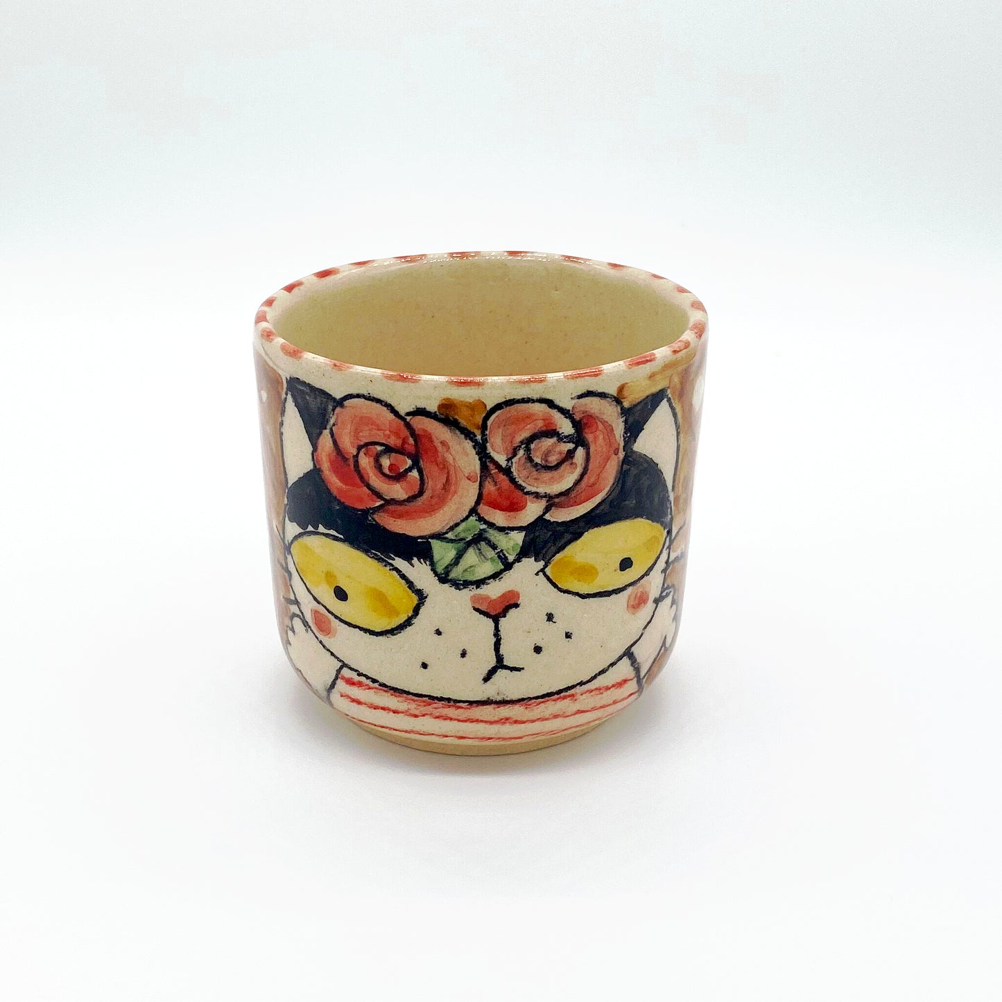 Ceramic tea cup with cat motif